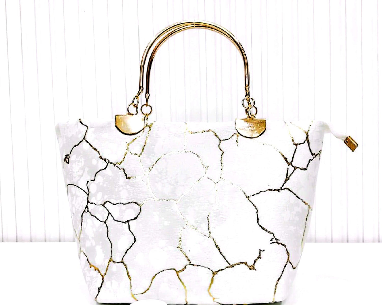 Elegant Printed Handbag with Gold Handle