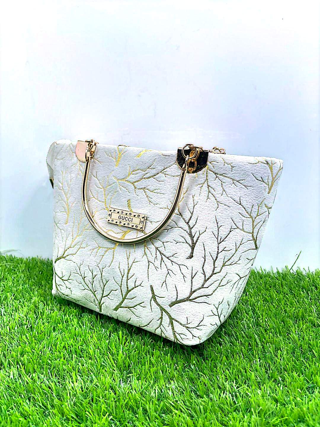 Elegant Printed Handbag with Gold Handle
